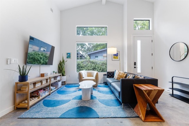 11233/4 Gunter St Unit 2, Austin, TX 78702 - living room featuring concrete flooring, high vaulted ceiling, and a healthy amount of sunlight
