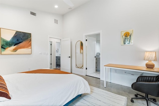 11233/4 Gunter St Unit 2, Austin, TX 78702 - bedroom featuring a towering ceiling, visible vents, baseboards, and finished concrete flooring