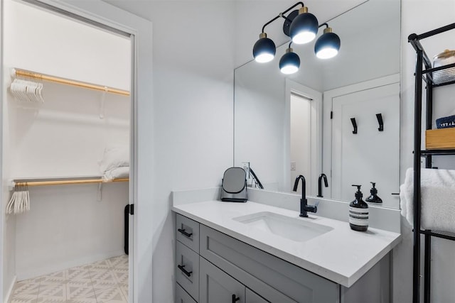 11233/4 Gunter St Unit 2, Austin, TX 78702 - bathroom with tile patterned floors, vanity, and a walk in closet