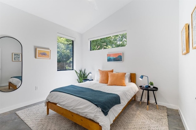 11233/4 Gunter St Unit 2, Austin, TX 78702 - bedroom featuring concrete flooring, baseboards, and high vaulted ceiling