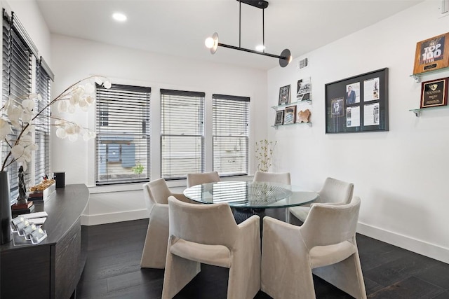 dining space with dark wood-type flooring