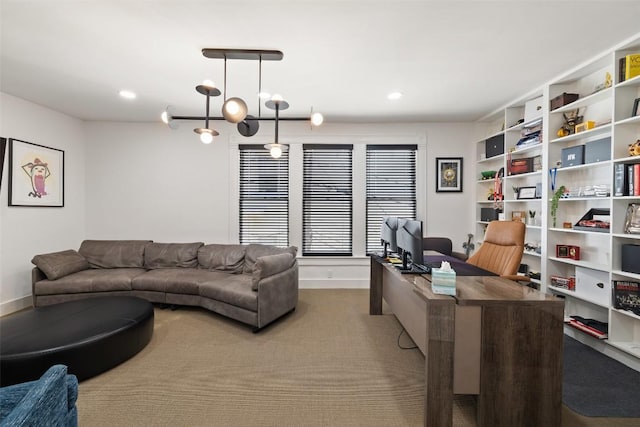 office area with a chandelier and carpet