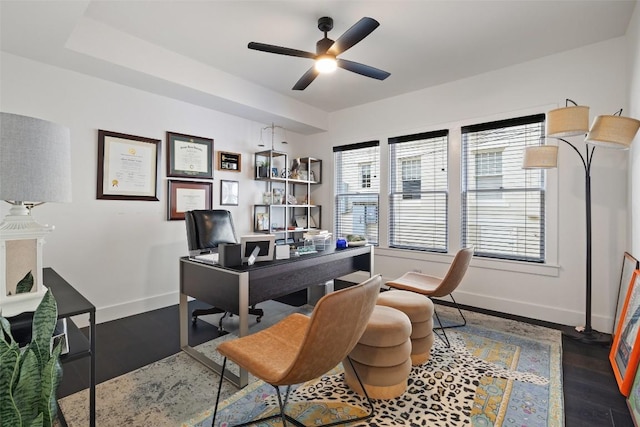 office space featuring dark hardwood / wood-style floors and ceiling fan