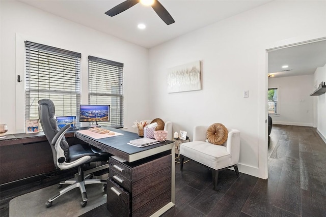 office area featuring dark hardwood / wood-style floors and ceiling fan