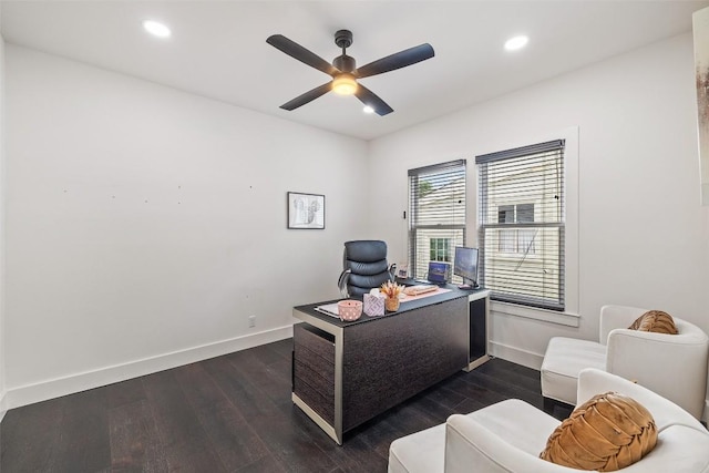 home office featuring dark hardwood / wood-style floors and ceiling fan