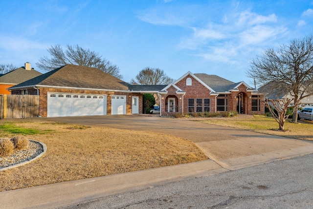 1207 Hyacinth Dr, Temple, TX 76502 - view of front facade featuring brick siding, a garage, and concrete driveway
