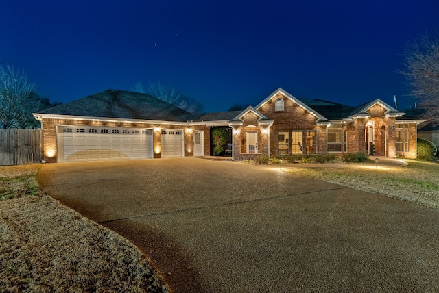 ranch-style house featuring a garage