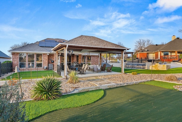 1207 Hyacinth Dr, Temple, TX 76502 - rear view of house featuring a patio area, brick siding, and roof with shingles