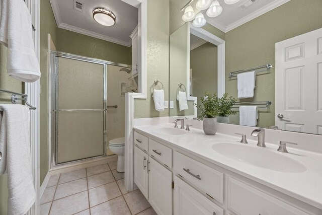 1207 Hyacinth Dr, Temple, TX 76502 - bathroom with crown molding, a stall shower, double vanity, and tile patterned flooring