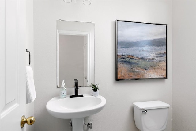 bathroom with sink and toilet