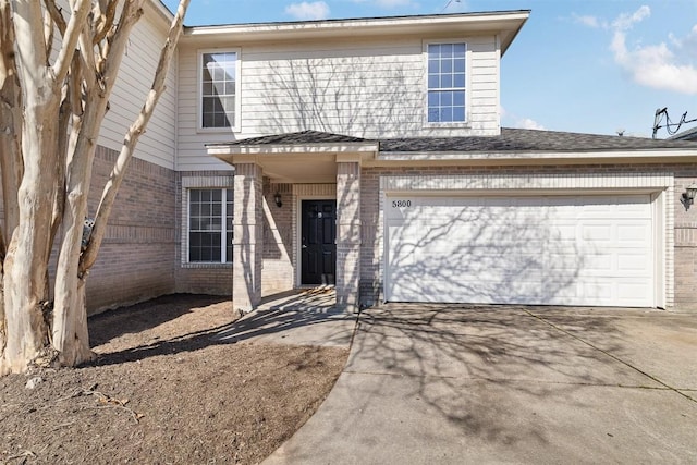 view of front of property featuring a garage