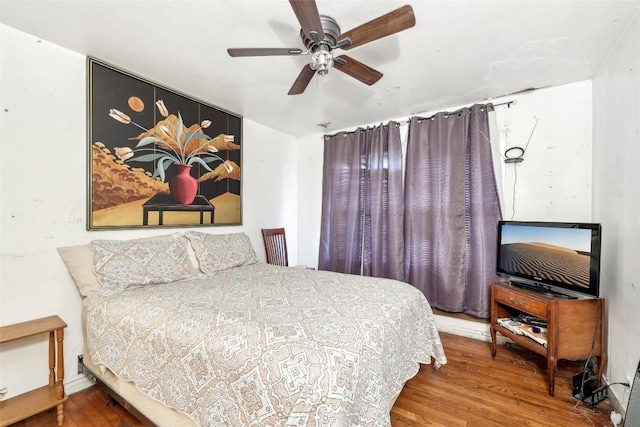 bedroom featuring hardwood / wood-style flooring and ceiling fan