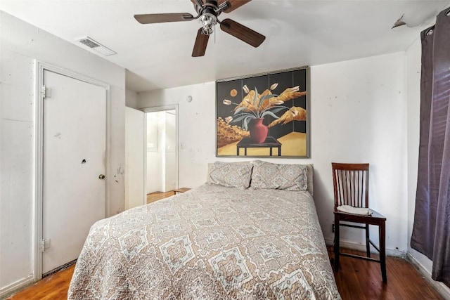 bedroom with hardwood / wood-style flooring and ceiling fan