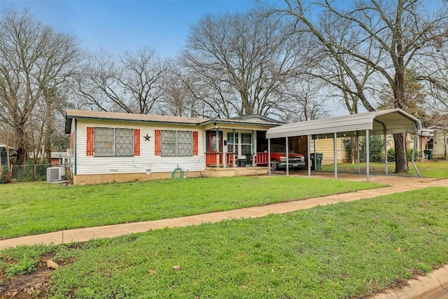 ranch-style home featuring a porch, a carport, and a front yard