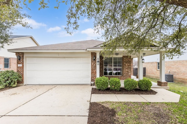 single story home featuring a garage and central AC