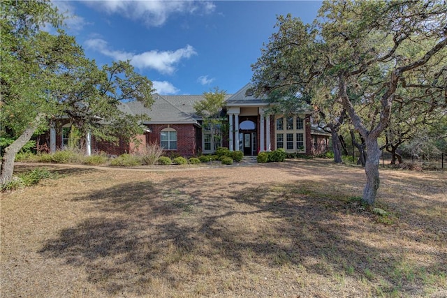 465 Hannah Dr, Dripping Springs, TX 78620 - neoclassical home with brick siding and a front lawn