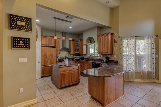 465 Hannah Dr, Dripping Springs, TX 78620 - kitchen featuring wall chimney exhaust hood, brown cabinets, black dishwasher, and light tile patterned floors
