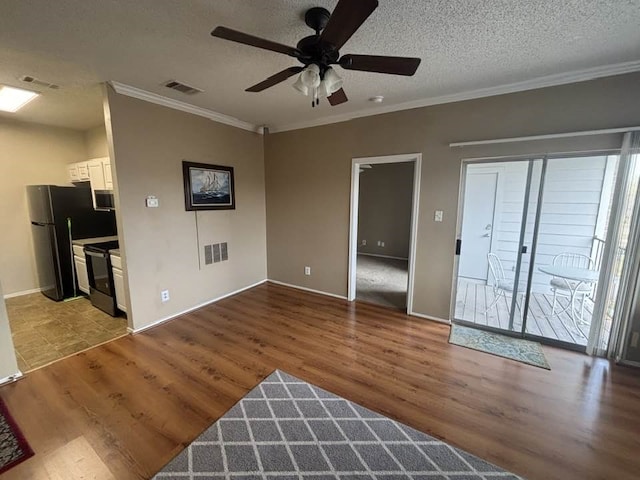 unfurnished living room with crown molding, ceiling fan, light hardwood / wood-style flooring, and a textured ceiling