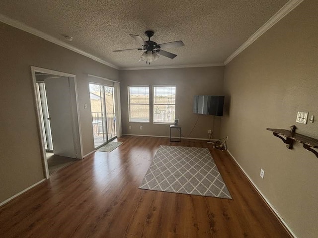 unfurnished living room with crown molding, dark hardwood / wood-style floors, and ceiling fan