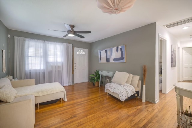 1406 Webberville Rd, Austin, TX 78721 - bedroom featuring light wood-type flooring and a ceiling fan