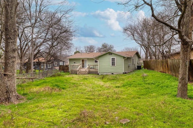 1406 Webberville Rd, Austin, TX 78721 - rear view of house featuring crawl space, a deck, and a fenced backyard
