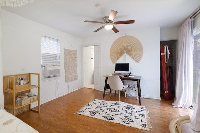1406 Webberville Rd, Austin, TX 78721 - office space featuring a ceiling fan, wood finished floors, and cooling unit