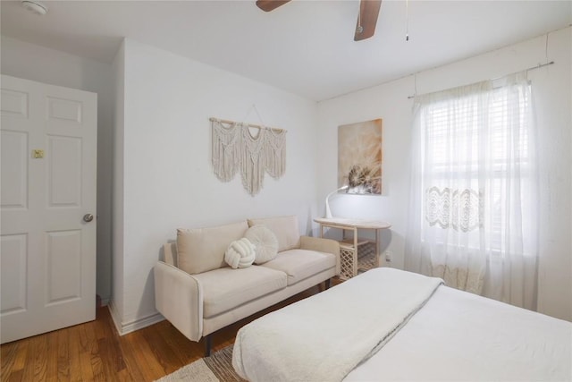 1406 Webberville Rd, Austin, TX 78721 - bedroom with wood finished floors and a ceiling fan