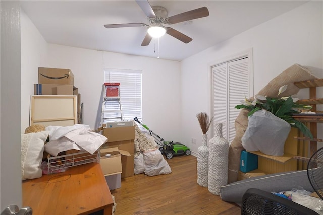 1406 Webberville Rd, Austin, TX 78721 - bedroom with wood finished floors, a closet, and ceiling fan