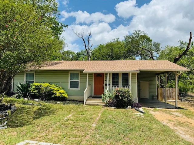 1406 Webberville Rd, Austin, TX 78721 - single story home featuring dirt driveway, a carport, and roof with shingles