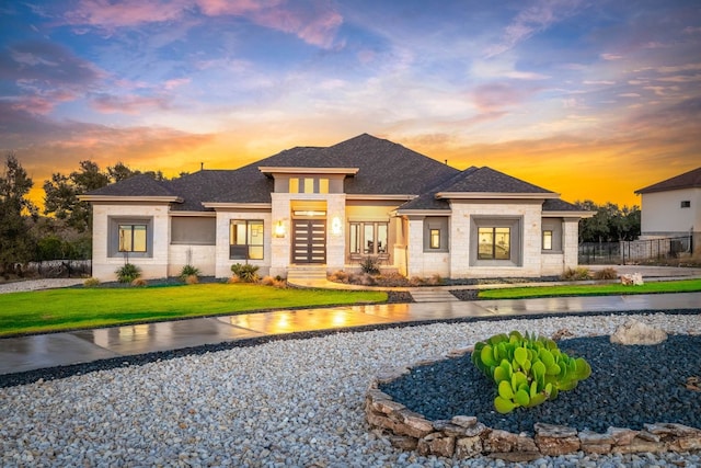 prairie-style house featuring a yard