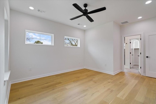 unfurnished room featuring light hardwood / wood-style flooring and ceiling fan