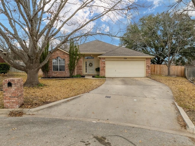 ranch-style house featuring a garage