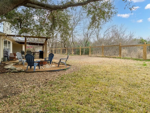 view of yard with a fire pit