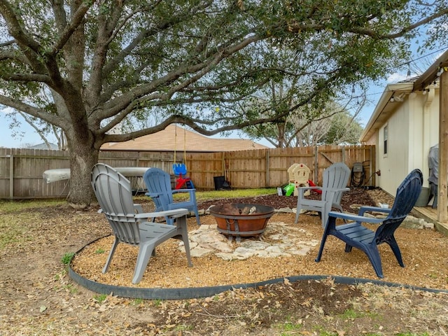 view of yard with an outdoor fire pit