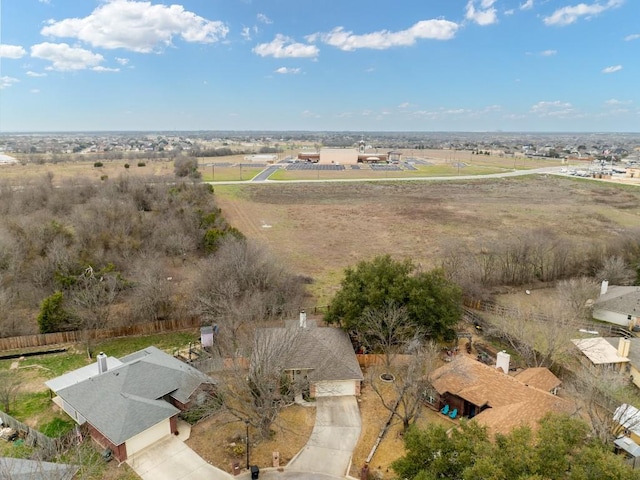 birds eye view of property with a rural view