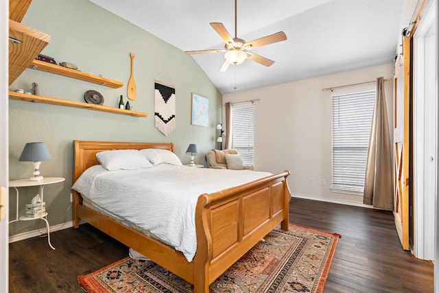 bedroom with dark hardwood / wood-style flooring, vaulted ceiling, and ceiling fan