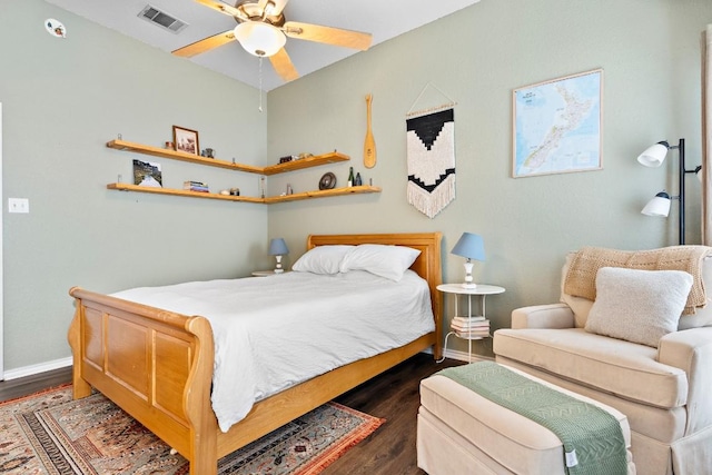 bedroom with dark hardwood / wood-style floors and ceiling fan