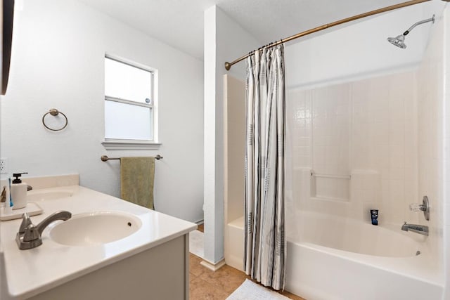 bathroom featuring vanity, tile patterned flooring, and shower / bath combo