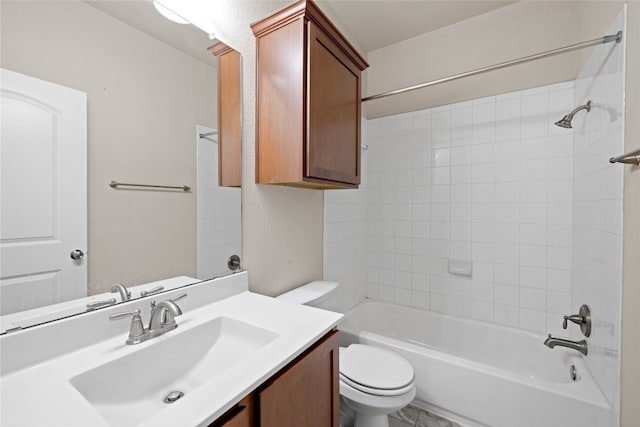 full bathroom with vanity, toilet, and tiled shower / bath combo