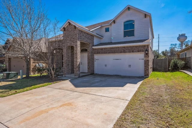 front of property featuring a garage and a front yard