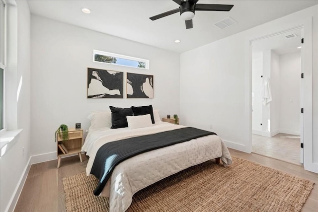 bedroom with wood-type flooring and ceiling fan