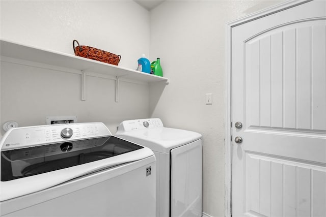 laundry room featuring washer and clothes dryer