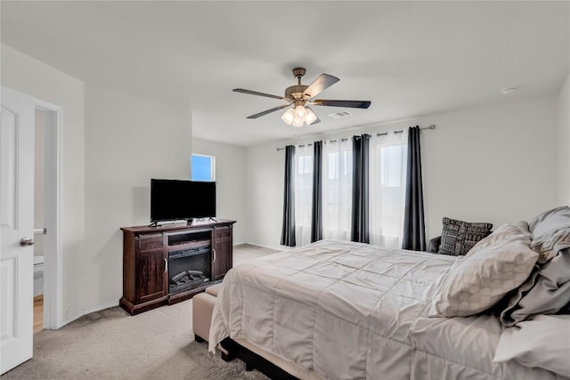 carpeted bedroom featuring ceiling fan