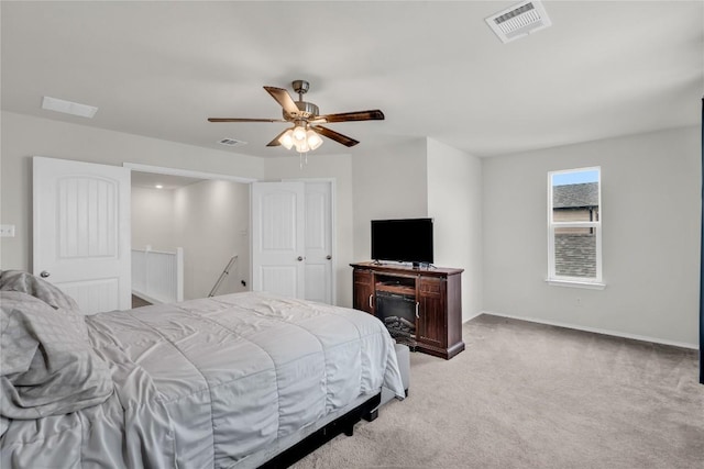 carpeted bedroom with ceiling fan