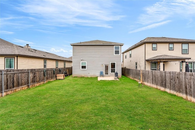 back of house with a patio and a yard