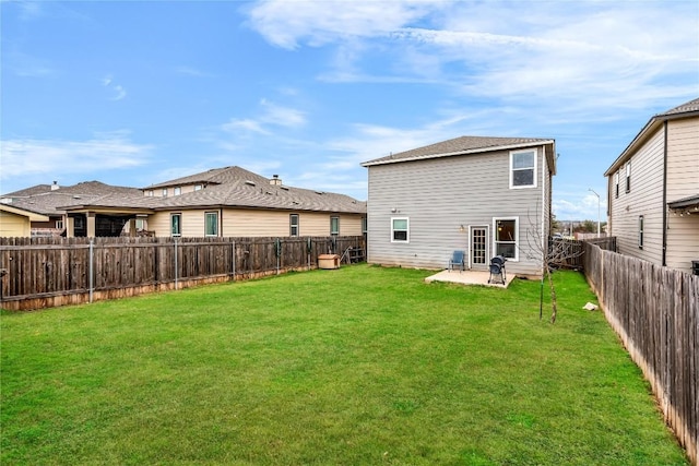 back of property featuring a patio and a lawn