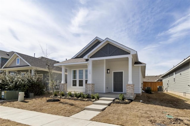168 Bosque Dr, San Marcos, TX 78666 - craftsman-style home with covered porch and central air condition unit