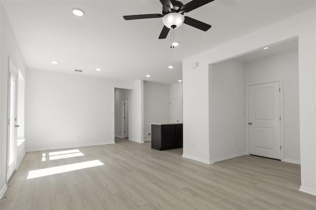 168 Bosque Dr, San Marcos, TX 78666 - unfurnished living room featuring light wood-style flooring, a ceiling fan, baseboards, and recessed lighting