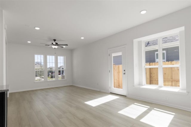 168 Bosque Dr, San Marcos, TX 78666 - unfurnished living room with baseboards, recessed lighting, light wood-type flooring, and ceiling fan