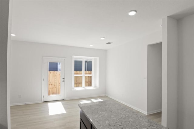 168 Bosque Dr, San Marcos, TX 78666 - spare room with recessed lighting, light wood-style floors, and baseboards